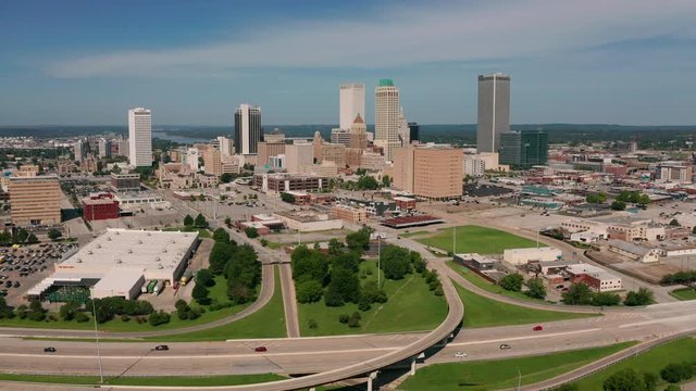 Aerial view traveling into the downtown city center urban core of Tulsa Oklahoma