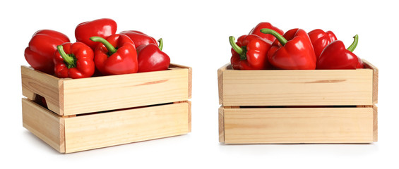 Red bell peppers in wooden crates on white background
