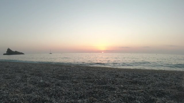 Nice and peaceful sunset on the shore of Palmi, Calabria - Italy. Timelapse steady camera shot