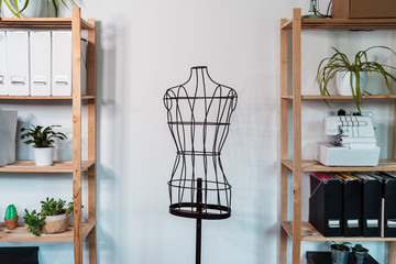 Wire dummy standing in modern loft style studio