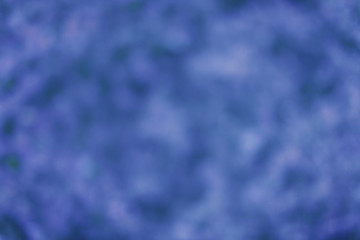 blurred blue texture. Kopi space. dark spots on a light background