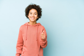 African american little boy isolated smiling and raising thumb up