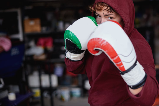 Determined sportswoman shadow boxing in gym