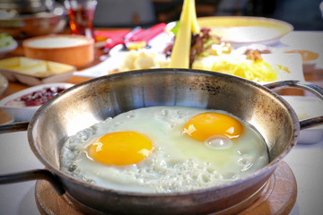 fried eggs on breakfast table