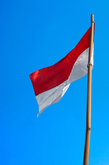 Naklejka na ściany i meble Indonesia flags in blue sky