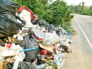 Spilled ,waste recycling garbage on the street, environmental pollution in the city, global warming problem 