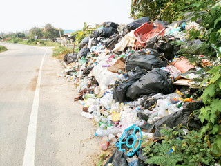 Spilled ,waste recycling garbage on the street, environmental pollution in the city, global warming problem 
