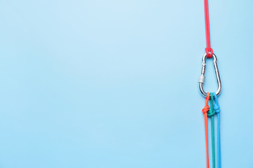 Ropes with lobster clasp on color background