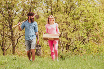 Fototapeta premium Farming and agriculture cultivation. Fresh organic vegetables from the farm. Couple Gardener. Worker family agriculture.