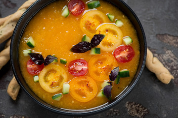 Close-up of gazpacho cold soup made of yellow tomatoes, high angle view, horizontal shot