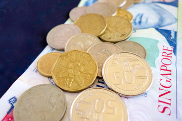 Singaporean coins on a bed of notes.