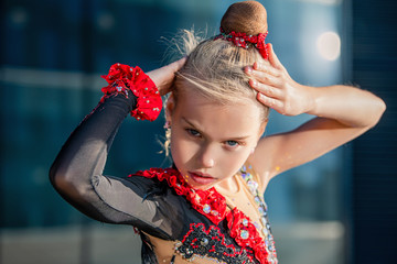 portrait of a girl gymnast performing a temperamental dance