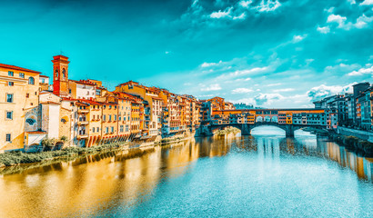 Obraz premium Ponte Vecchio is a bridge in Florence, located at the narrowest point of the Arno River, almost opposite the Uffizi Gallery.Italy.
