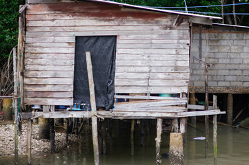 The condition of the houses of the village built in the sea.