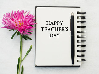 Naklejka premium Happy Teacher's Day. Beautiful greeting card. Close-up, view from above. National holiday concept. Congratulations for family, relatives, friends and colleagues