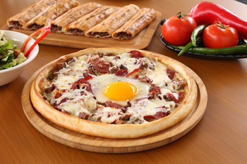 Traditional turkish flavor pide, Turkish pizza with cheese, mince and bacon mixed