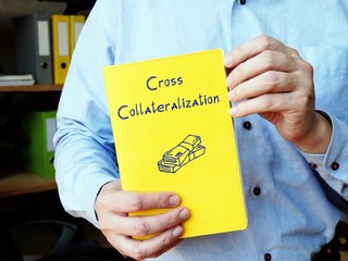 Financial concept meaning Cross Collateralization with inscription on the sheet.
