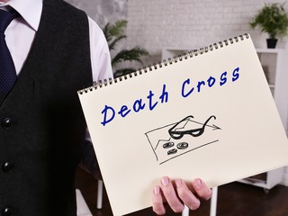 Business concept about Death Cross with phrase on the piece of paper.