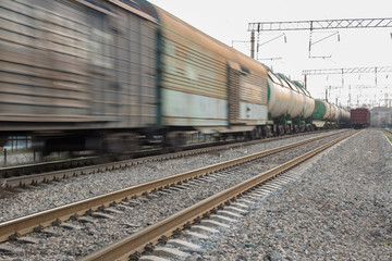Fototapeta na wymiar freight train moves fast during sunset.