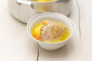 chicken soup on a white table