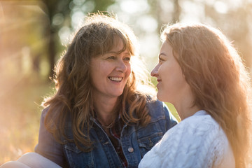 Fototapeta premium Mother and adult daughter outdoor talk