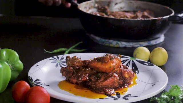 serving chicken gravy in a plate, food serving