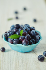 blueberries on a white wooden surface