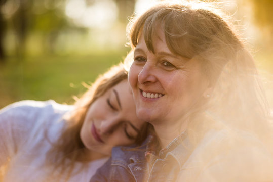 Happiness - mature mother with her teen daughter