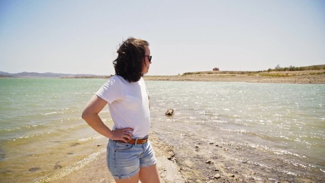 Young woman enjoying travelling near Barrage El Mansour Eddahbi. Morocco.