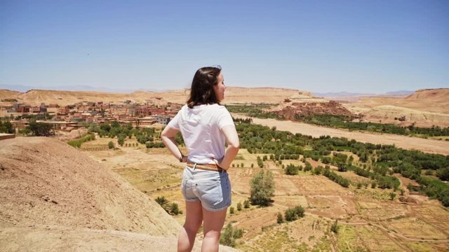 Young woman enjoying the scenery near Barrage El Mansour Eddahbi Morocco.