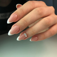 French manicure on the nails. French manicure design. Manicure gel nail polish