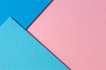 Abstract color papers geometry flat lay composition background with blue and pink color tones