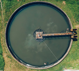 Aerial top view of poll in wastewater treatment plant, filtration of dirty or sewage water. Circle