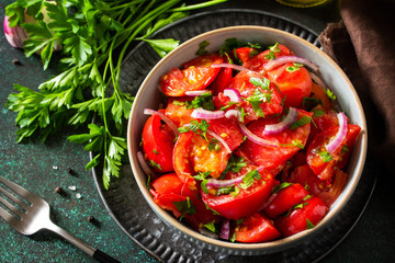 Summer Vegetable salad with fresh tomato, onion and olive oil. Healthy food.