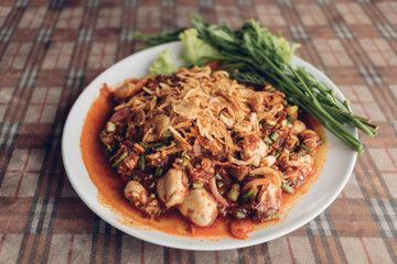 Fresh Oysters salad with garlics served on the table in Thailand local restaurant.