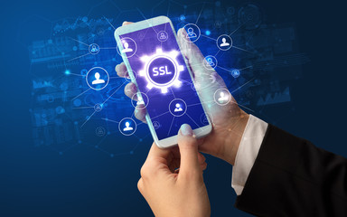 Female hand holding smartphone with SSL abbreviation, modern technology concept
