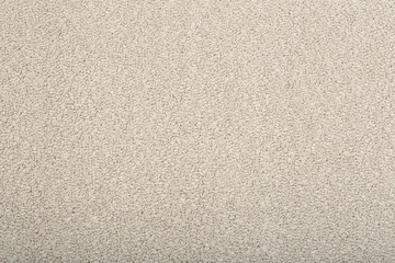 Fototapeta na wymiar Beige carpet background. Gray carpet with texture on the surface. Materials and items for interior design of rooms and houses