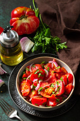 Summer Vegetable salad with fresh tomato, onion and olive oil. Healthy food.