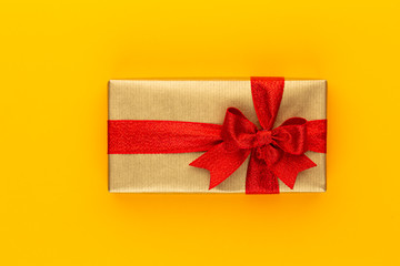 Christmas gift boxes with ribbons on color tabletop.
