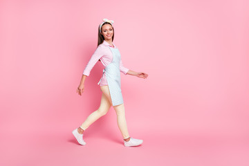 Fototapeta na wymiar Full length profile side photo of nice attractive content girl go walk copyspace wear good look outfit isolated over pink color background