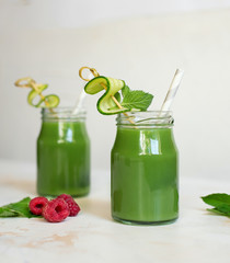 Green smoothie. Glass. The concept of a healthy lifestyle.