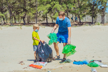 Volunteer blue face mask forest sand beach. Son helps father hold black bag for pick up garbage....