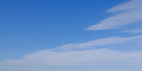 Blue spring sky with white clouds. Beautiful background.