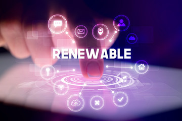 Finger touching tablet with web technology icons and RENEWABLE inscription, web technology concept