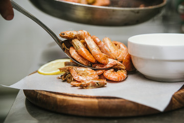 Serving with fresh cooked shrimps by chef