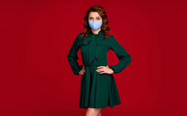 Portrait of her she nice attractive pretty wavy-haired girl wearing reusable textile mask posing stop contamination isolated bright vivid shine vibrant red maroon color background