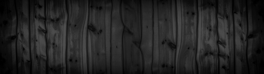 Dark wooden background panorama banner - Rustic black anthracite wooden facade with wooden boards...