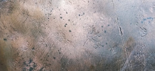 Bronze metal surface. Uneven metal texture with scratches, gouges and dents. Red, brown, orange,...