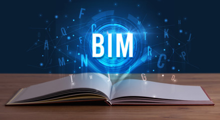 BIM inscription coming out from an open book, digital technology concept