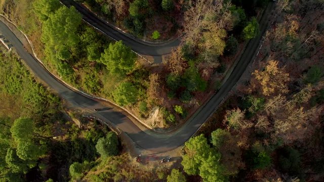 Aerial Top-Down shot of the  Highway in the Hills Connecting Bir and the top of Paragliding spot in Billing, Himachal Pradesh, shot with a drone in 4k.